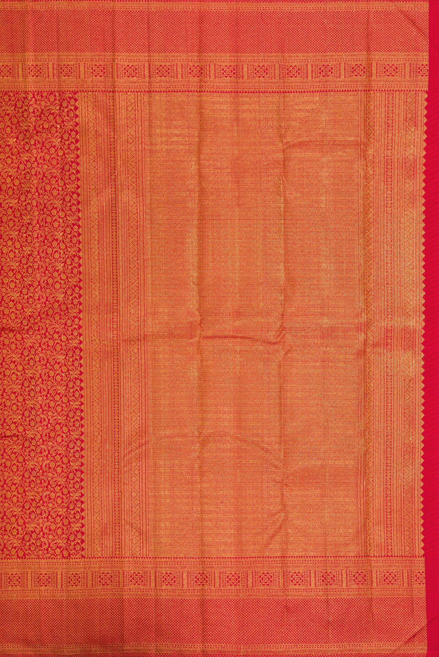 Close up image of the pallu of Red Dual Tone Kanchipuram Silk Saree with Zari Brocade on the body and Zari Border. 