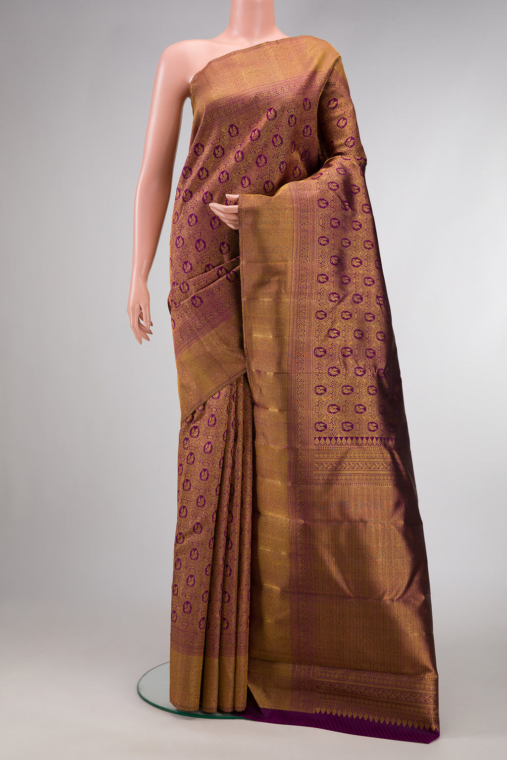 Purple Dual Tone Kanchipuram Silk Saree with Zari Brocade on the body and Zari Border.  displayed on a mannequin