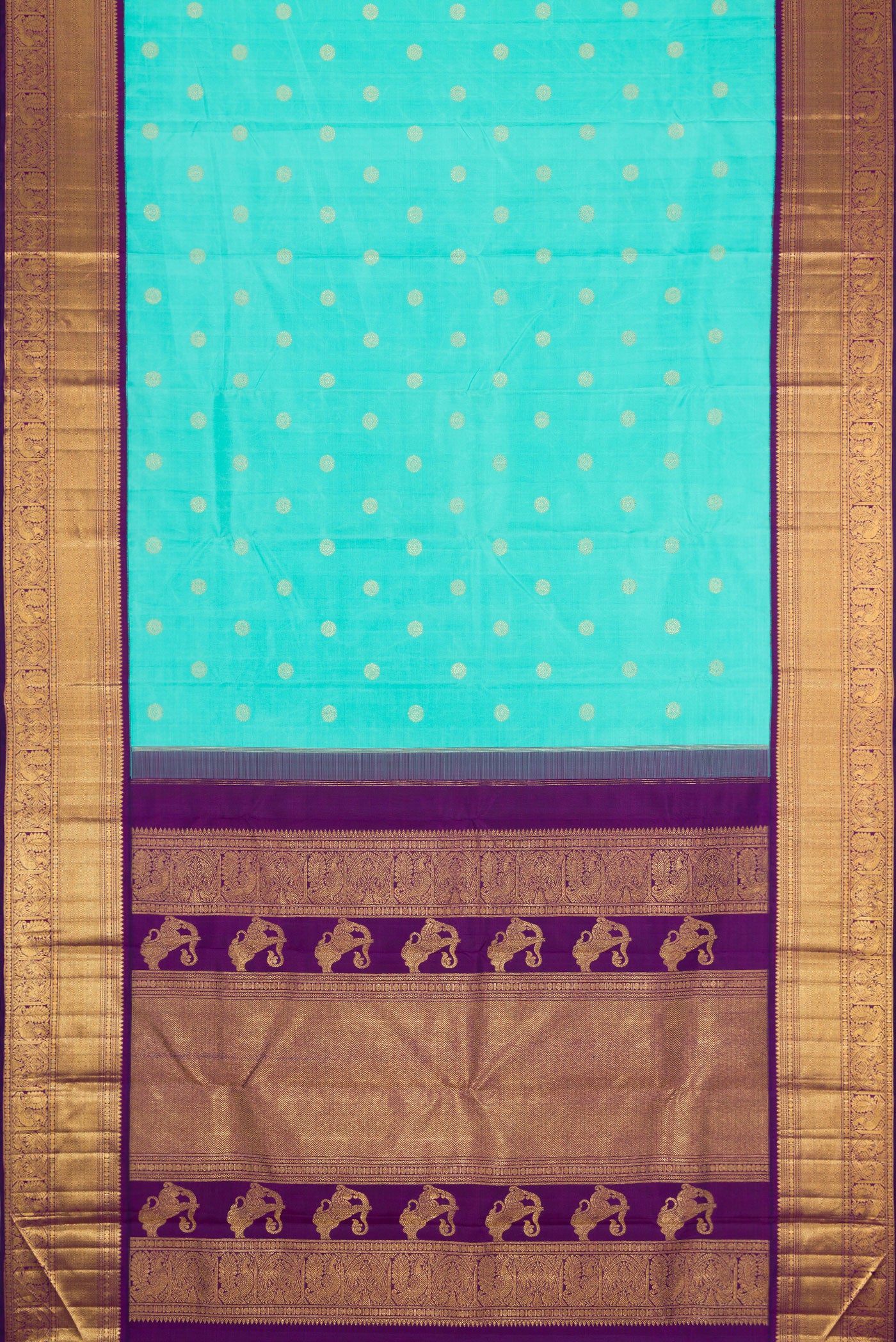 Flat view of Sky Blue Dual Tone Kanchipuram Silk Saree with Zari Butta on the body and Zari Border. 