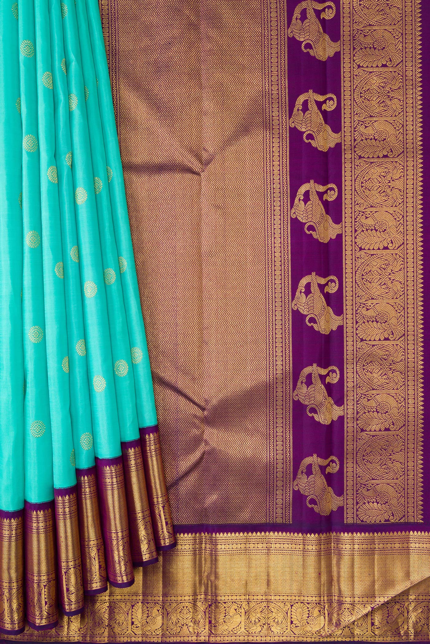Pleats and pallu of Sky Blue Dual Tone Kanchipuram Silk Saree with Zari Butta on the body and Zari Border. 