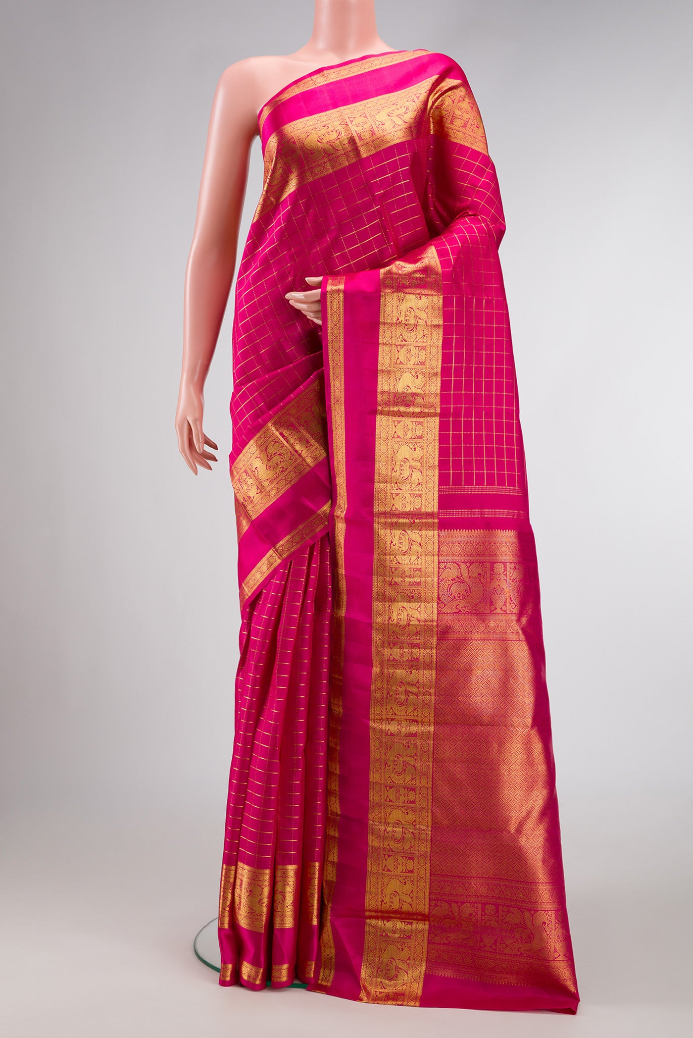 Pink Dual Tone Kanchipuram Silk Saree with Zari Butta on the body and Zari Border.  displayed on a mannequin