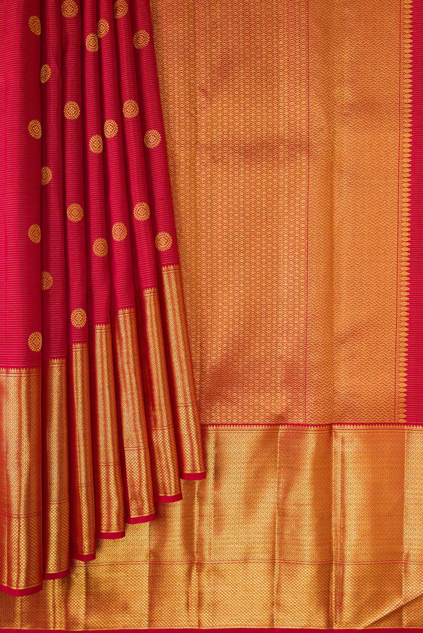 Pleats and pallu of Maroon Dual Tone Kanchipuram Silk Saree with Zari Butta on the body and Zari Border. 