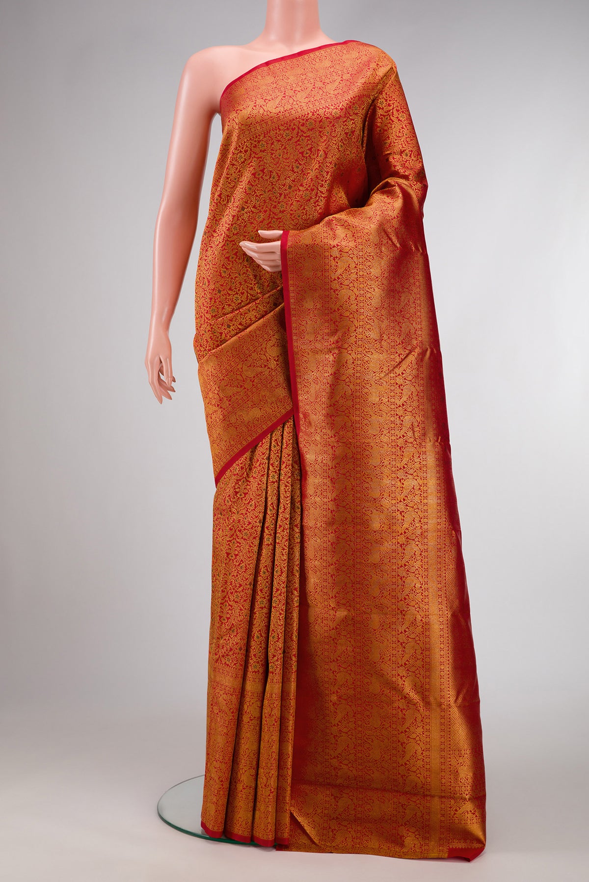 Red Dual Tone Kanchipuram Silk Saree with Zari Brocade on the body and Zari Border.  displayed on a mannequin
