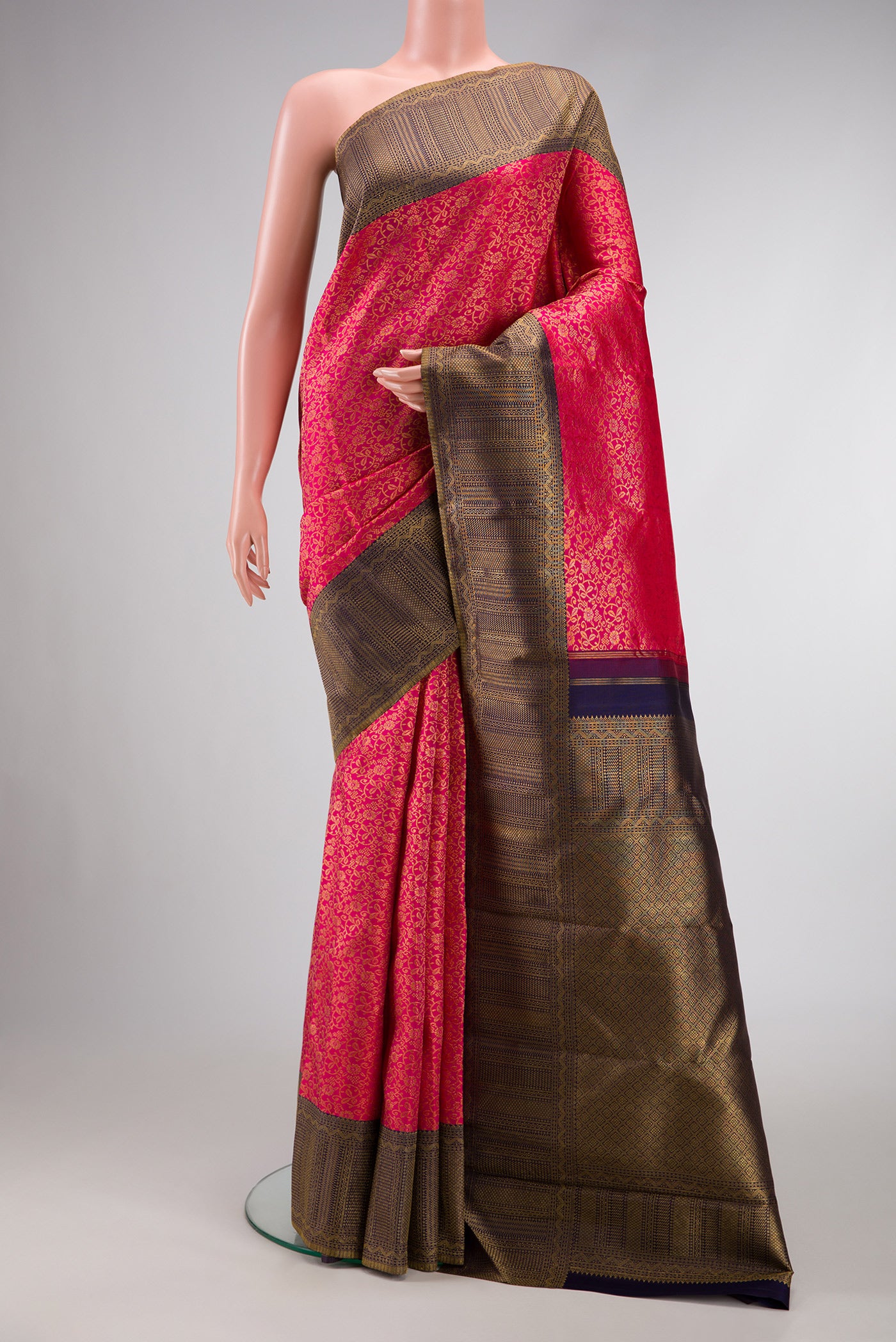 Dark Pink Dual Tone Kanchipuram Silk Saree with Zari Brocade on the body and Zari Border.  displayed on a mannequin