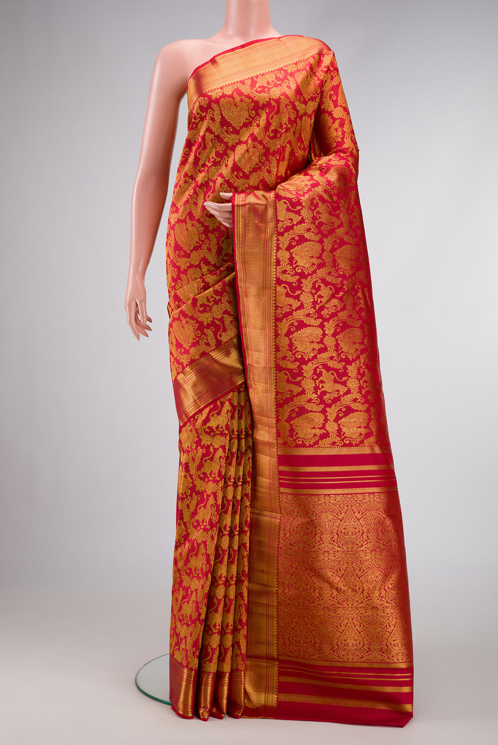 Maroon Dual Tone Kanchipuram Silk Saree with Zari Brocade on the body and Zari Border.  displayed on a mannequin