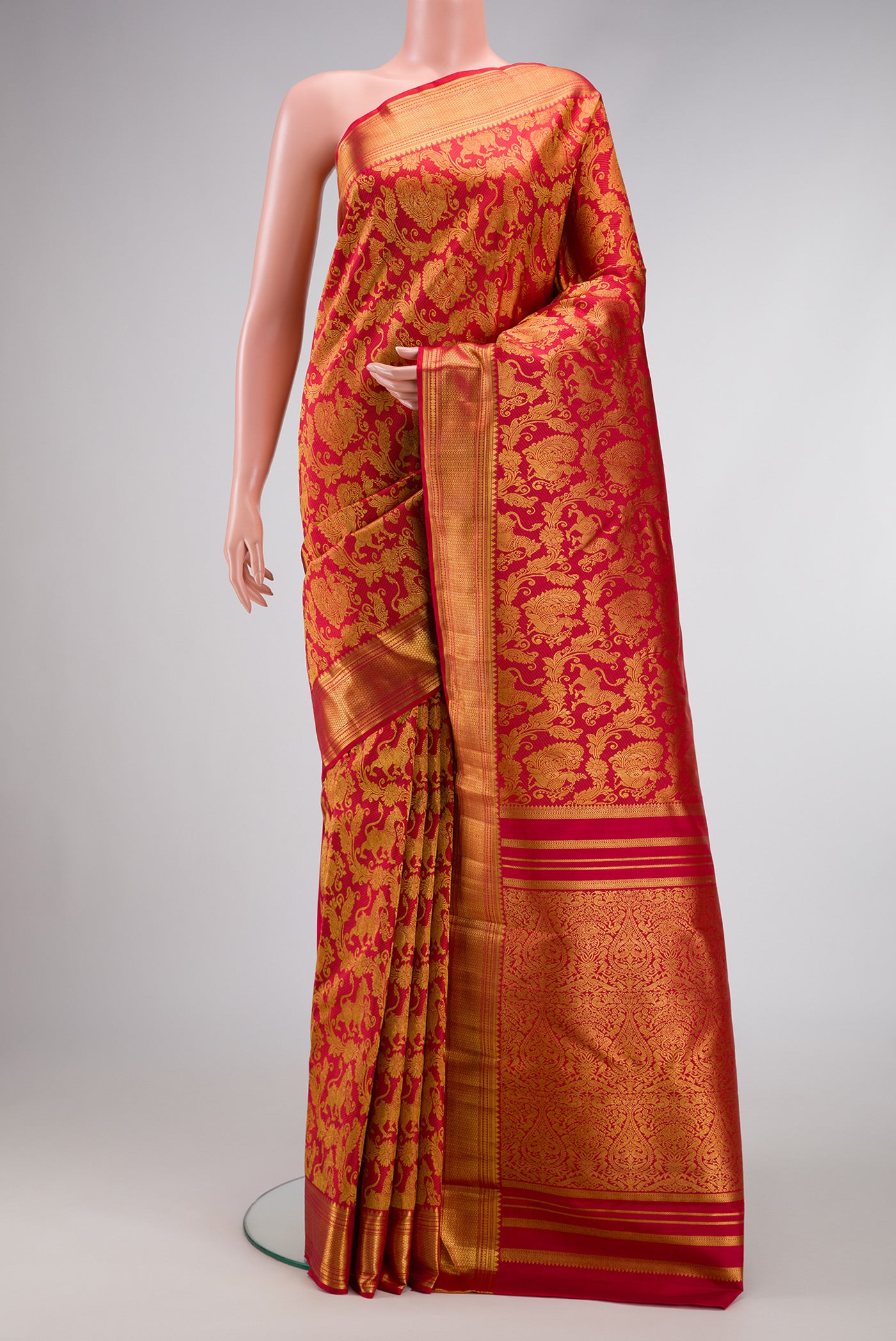 Maroon Dual Tone Kanchipuram Silk Saree with Zari Brocade on the body and Zari Border.  displayed on a mannequin