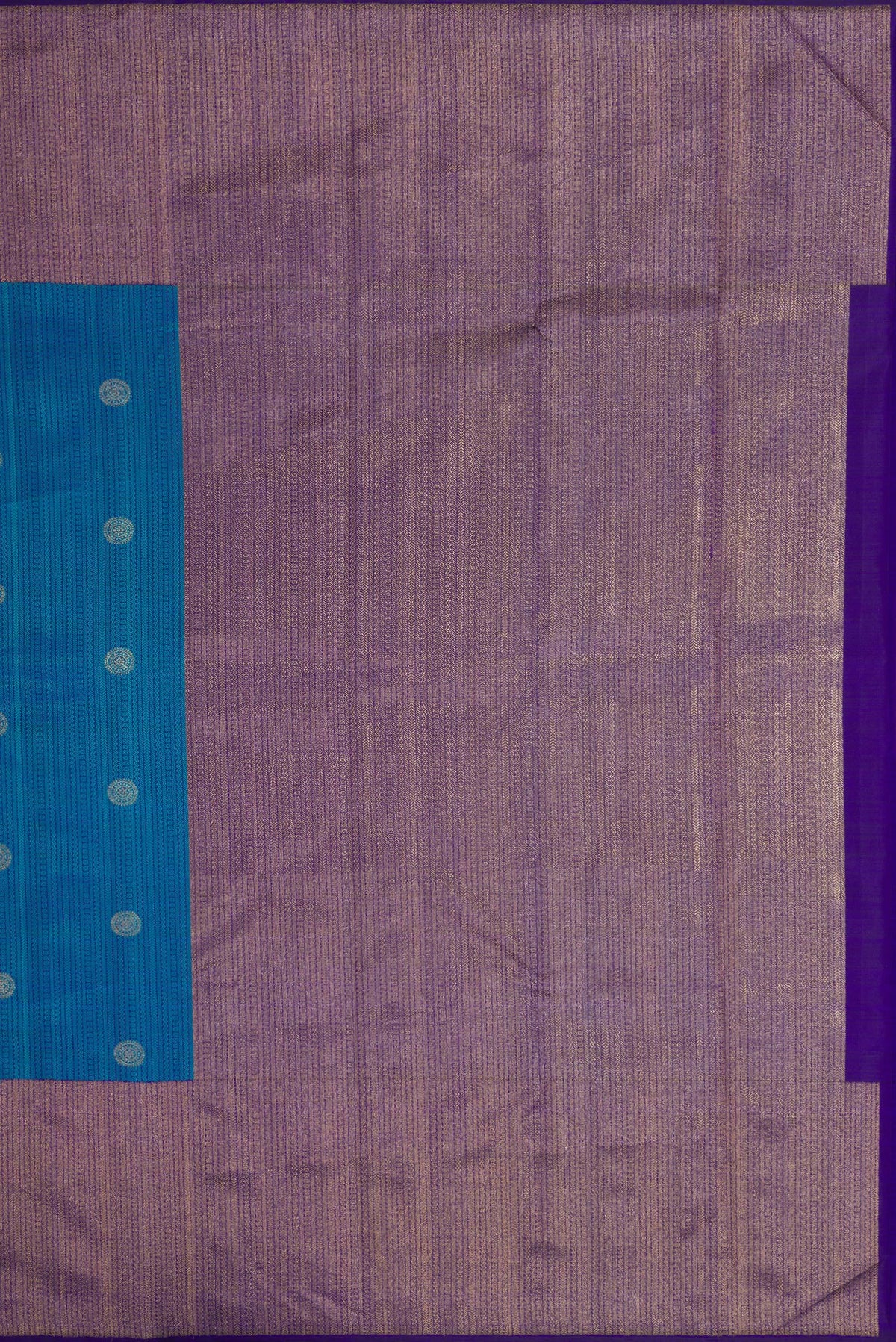Close up image of the pallu of Peacock Blue Dual Tone Kanchipuram Silk Saree with Jacquard With Zari Butta on the body and Zari Border. 