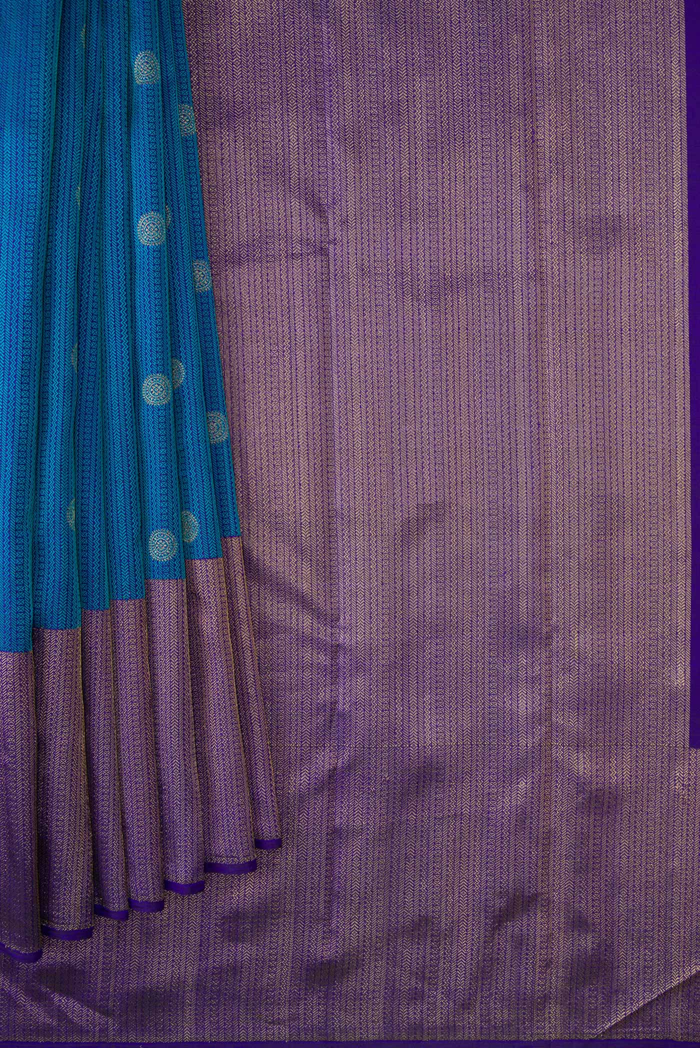 Pleats and pallu of Peacock Blue Dual Tone Kanchipuram Silk Saree with Jacquard With Zari Butta on the body and Zari Border. 