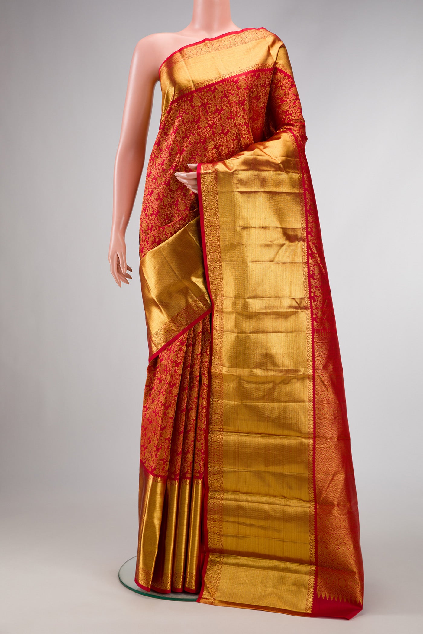 Red Dual Tone Kanchipuram Silk Saree with Zari Brocade on the body and Zari Border.  displayed on a mannequin