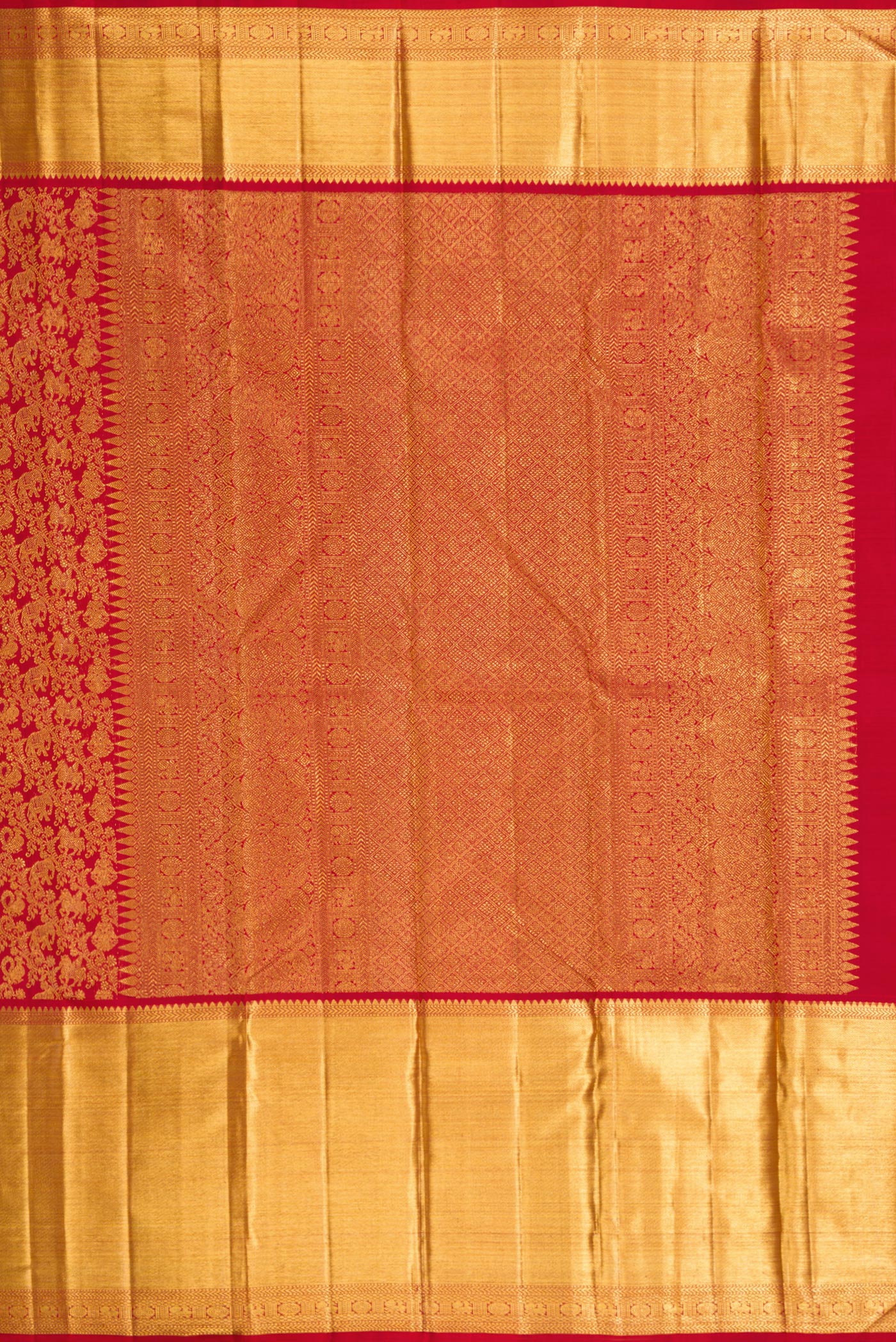 Close up image of the pallu of Red Dual Tone Kanchipuram Silk Saree with Zari Brocade on the body and Zari Border. 