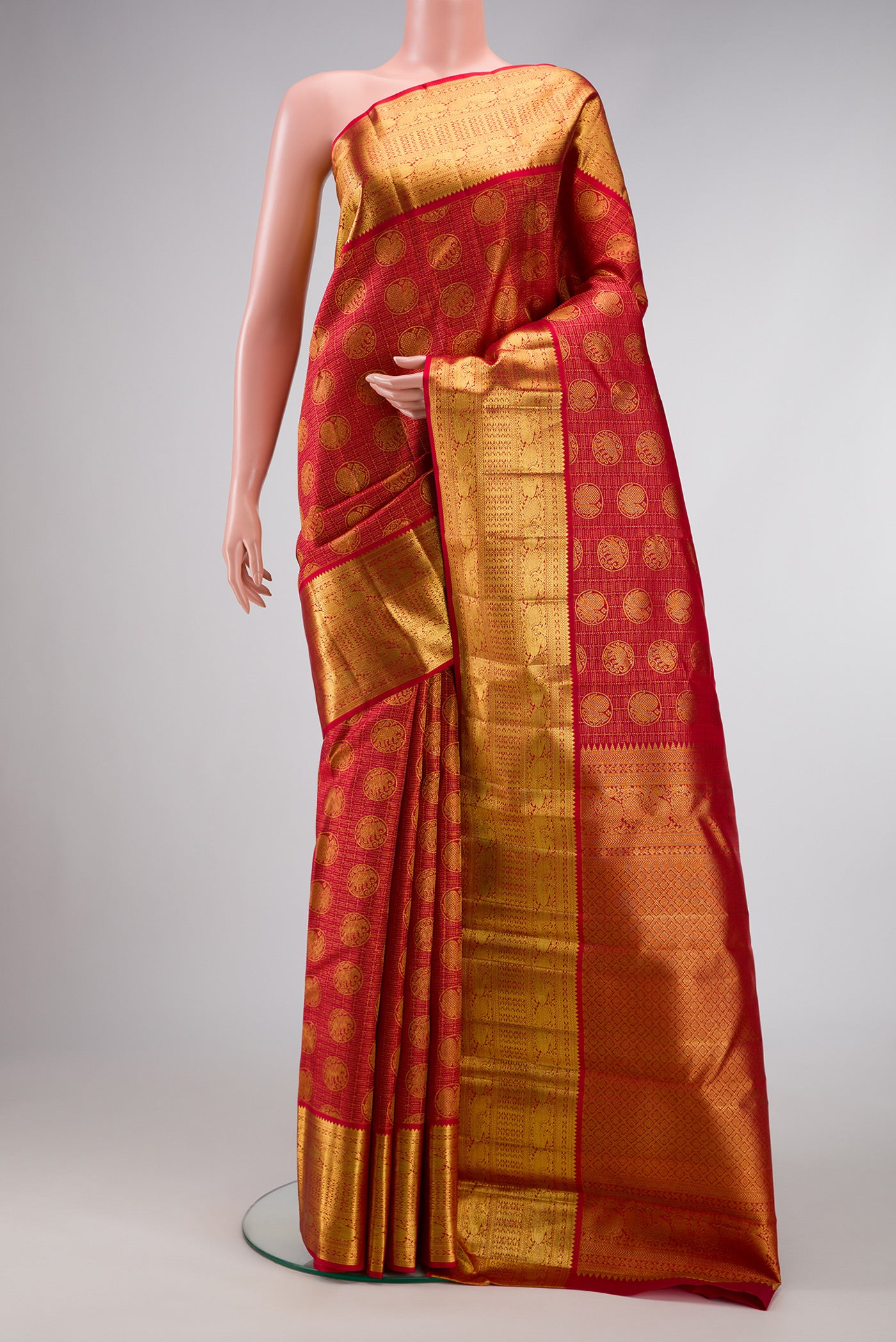 Maroon Dual Tone Kanchipuram Silk Saree with Zari Brocade on the body and Zari Border.  displayed on a mannequin