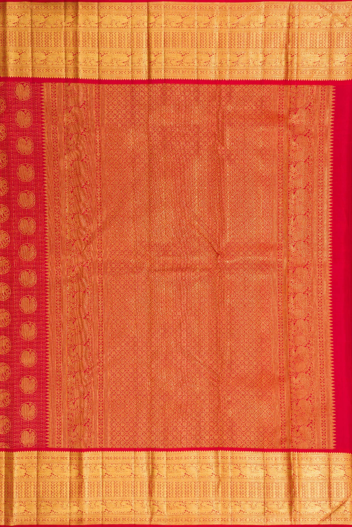 Close up image of the pallu of Maroon Dual Tone Kanchipuram Silk Saree with Zari Brocade on the body and Zari Border. 