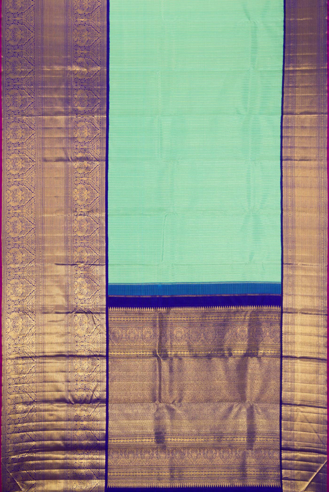 Flat view of Pista Green Dual Tone Kanchipuram Silk Saree with Zari Brocade on the body and Zari Border. 