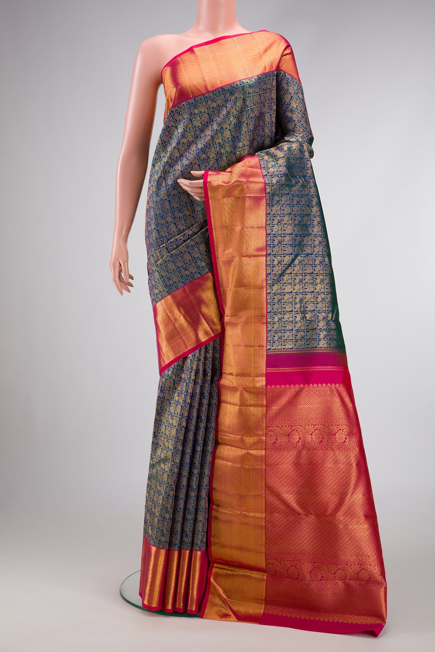 Peacock Blue Dual Tone Kanchipuram Silk Saree with Zari Brocade on the body and Zari Border.  displayed on a mannequin