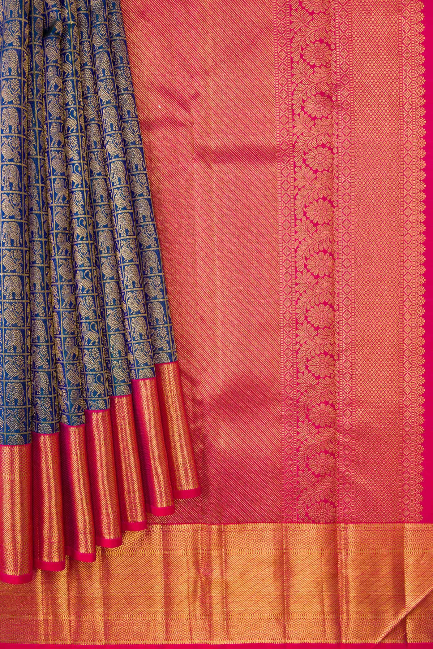 Pleats and pallu of Peacock Blue Dual Tone Kanchipuram Silk Saree with Zari Brocade on the body and Zari Border. 