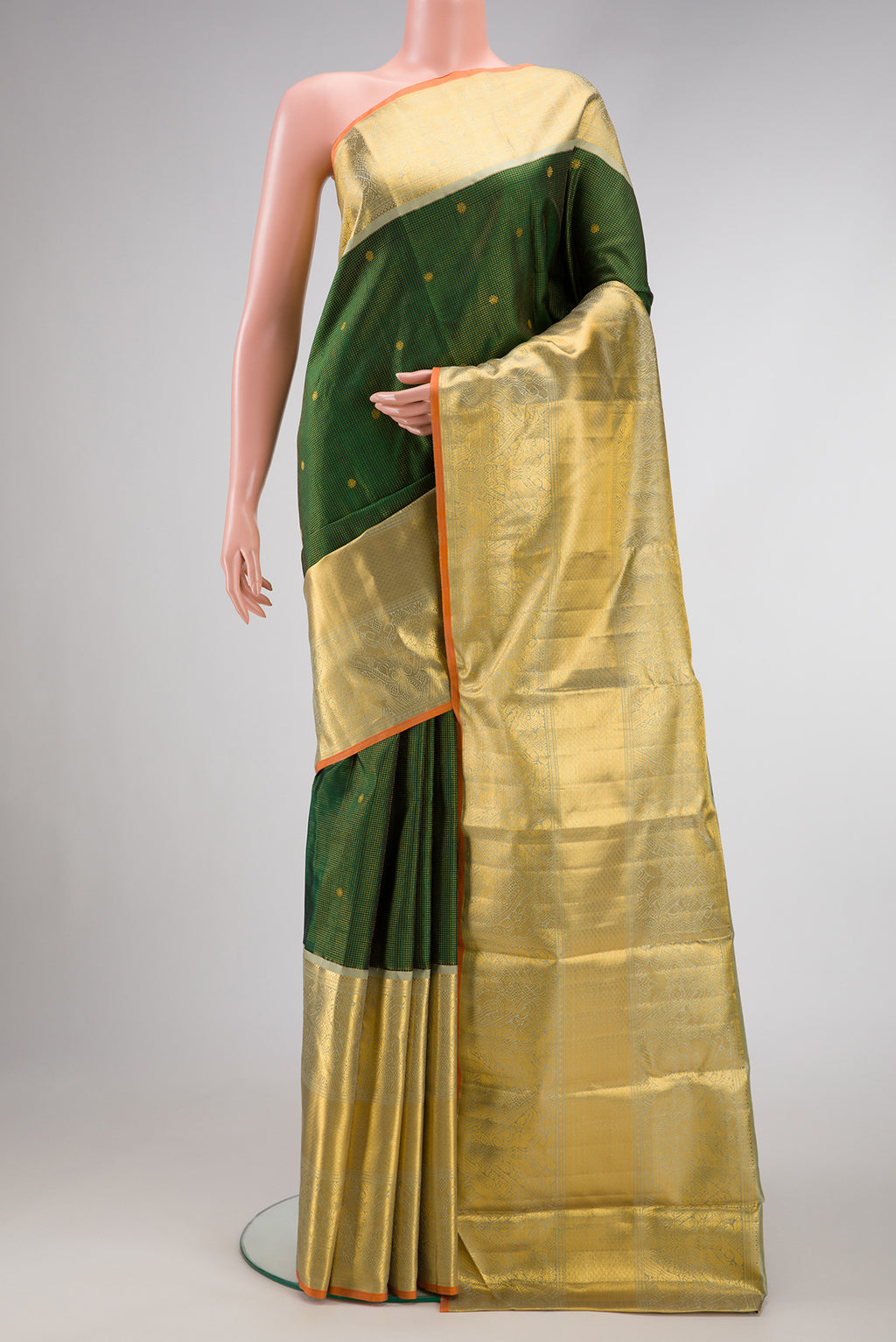 Green Dual Tone Kanchipuram Silk Saree with Zari Brocade on the body and Zari Border.  displayed on a mannequin