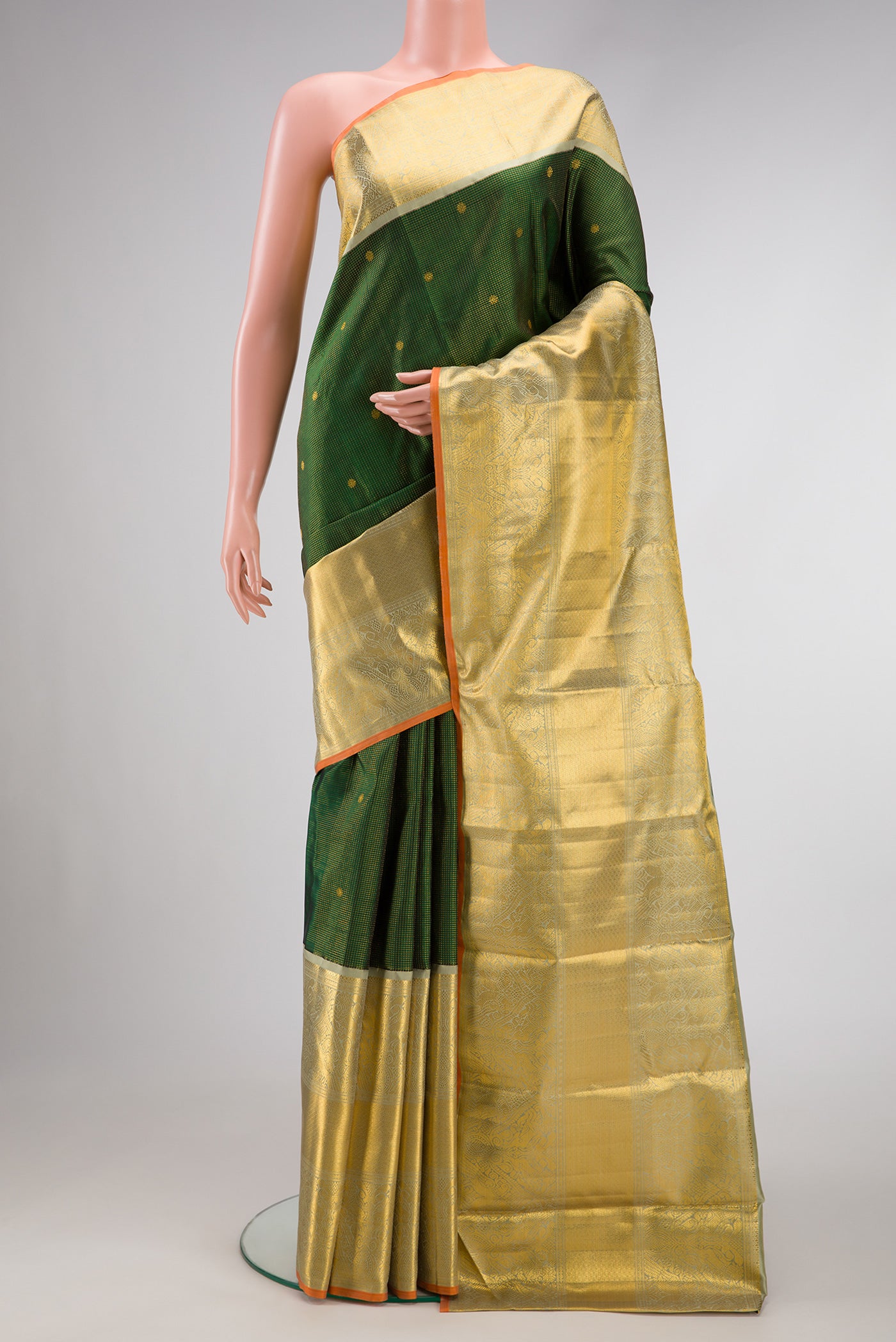 Green Dual Tone Kanchipuram Silk Saree with Zari Brocade on the body and Zari Border.  displayed on a mannequin