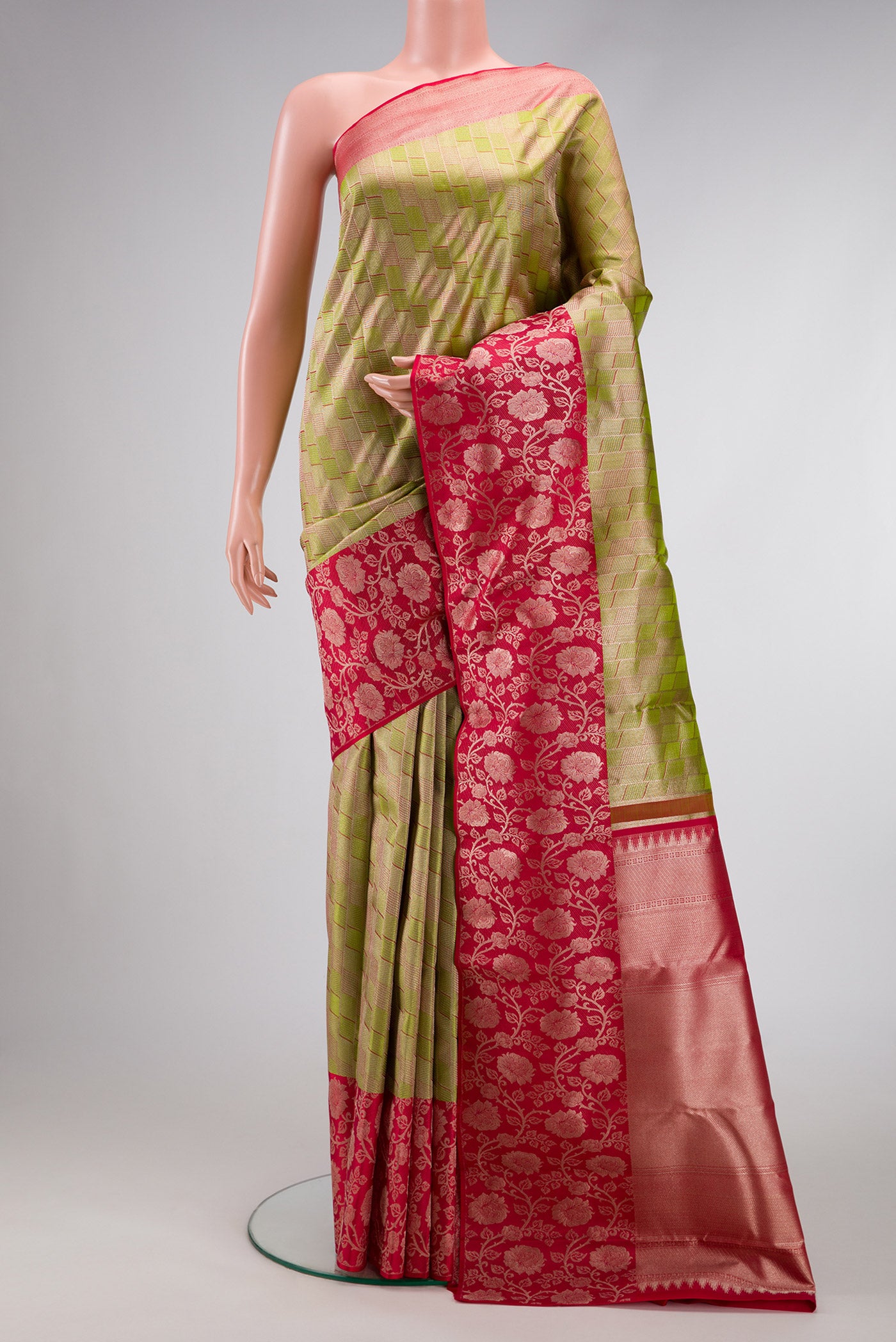Parrot Green Dual Tone Kanjivaram Tissue Silk Saree with Zari Brocade on the body and Fancy Border.  displayed on a mannequin