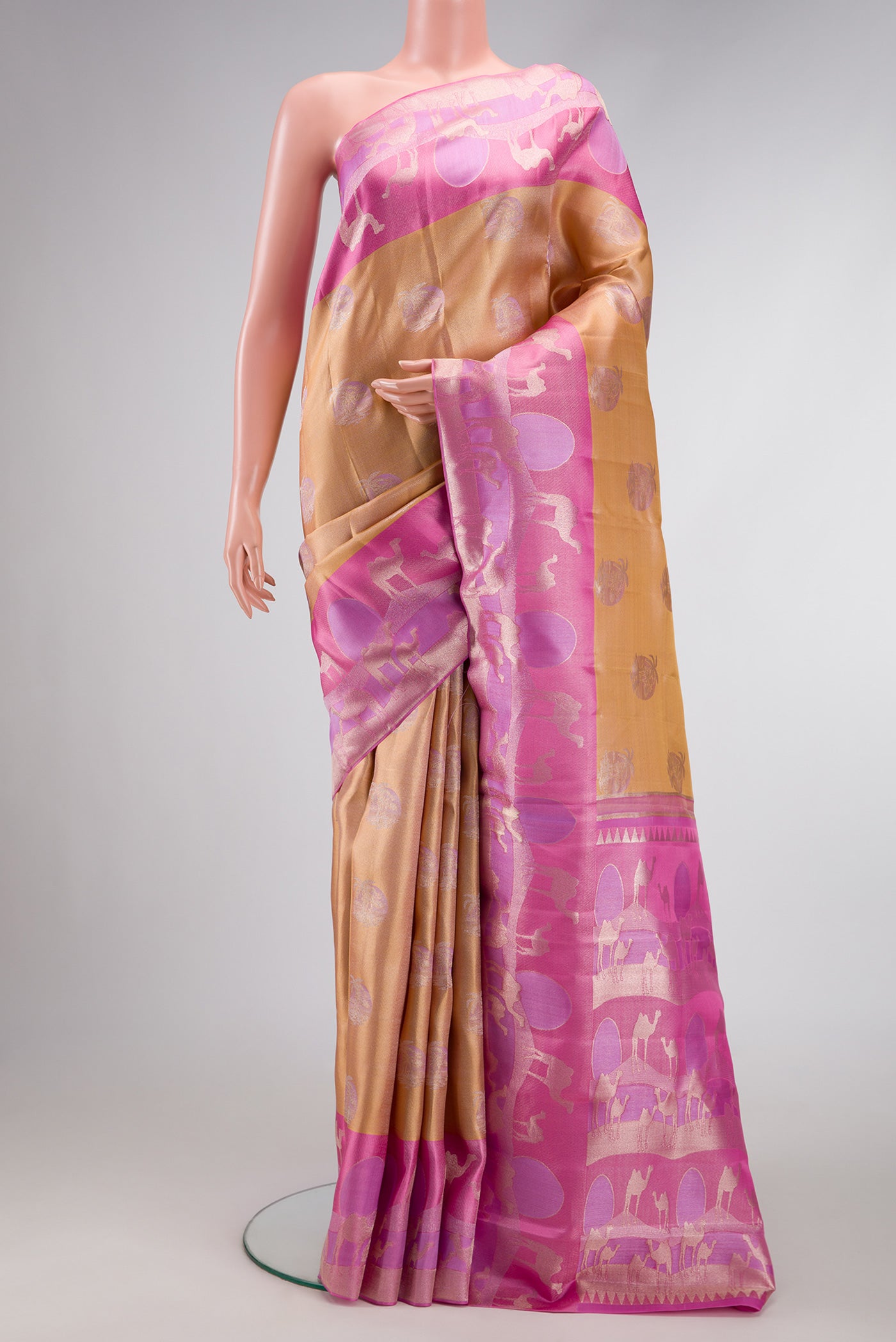 Gold Dual Tone Kanjivaram Tissue Silk Saree with Zari Brocade on the body and Fancy Border.  displayed on a mannequin