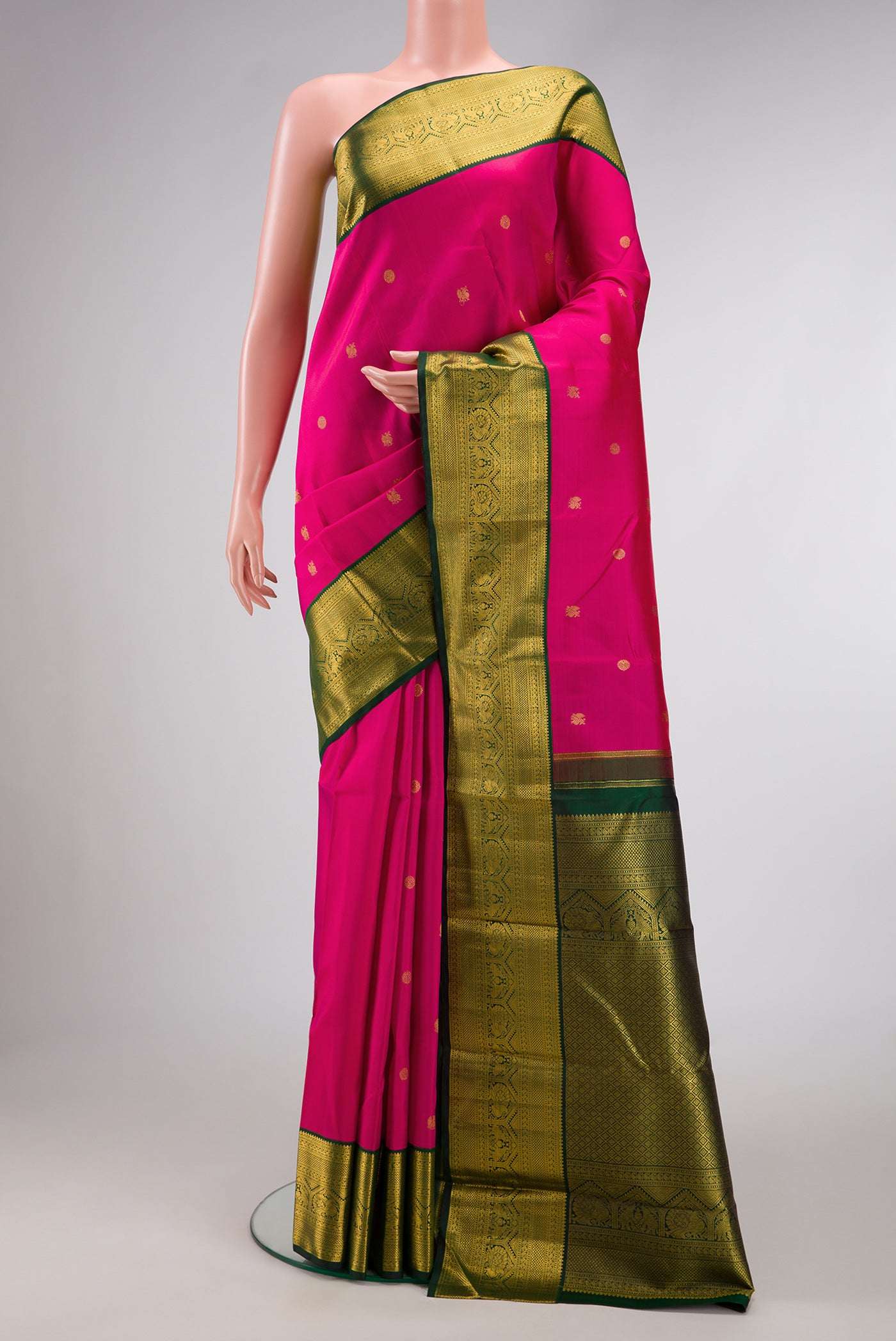 Pink Dual Tone Kanchipuram Silk Saree with Zari Butta on the body and Zari Border.  displayed on a mannequin