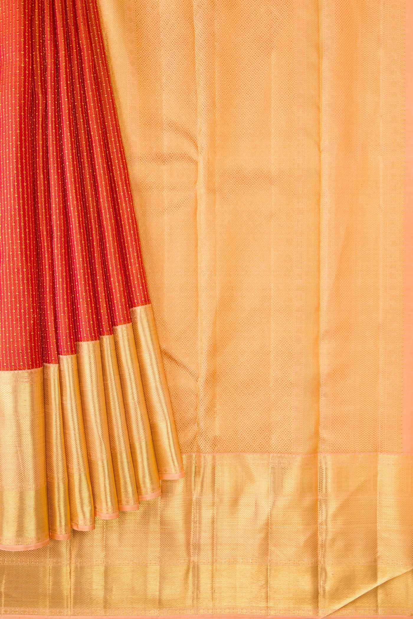Pleats and pallu of Brick Orange Dual Tone Kanchipuram Silk Saree with Zari Brocade on the body and Zari Border. 