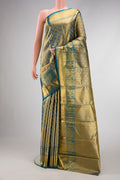 Maya Blue Dual Tone Kanchipuram Tissue Silk Saree with Zari Brocade on the body and Zari Border.  displayed on a mannequin
