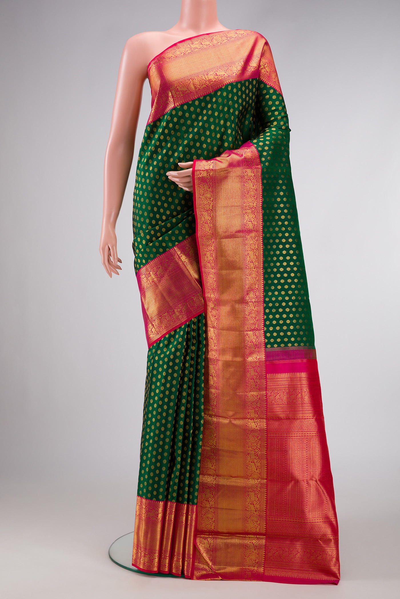Green Dual Tone Kanchipuram Silk Saree with Zari Brocade on the body and Zari Border.  displayed on a mannequin