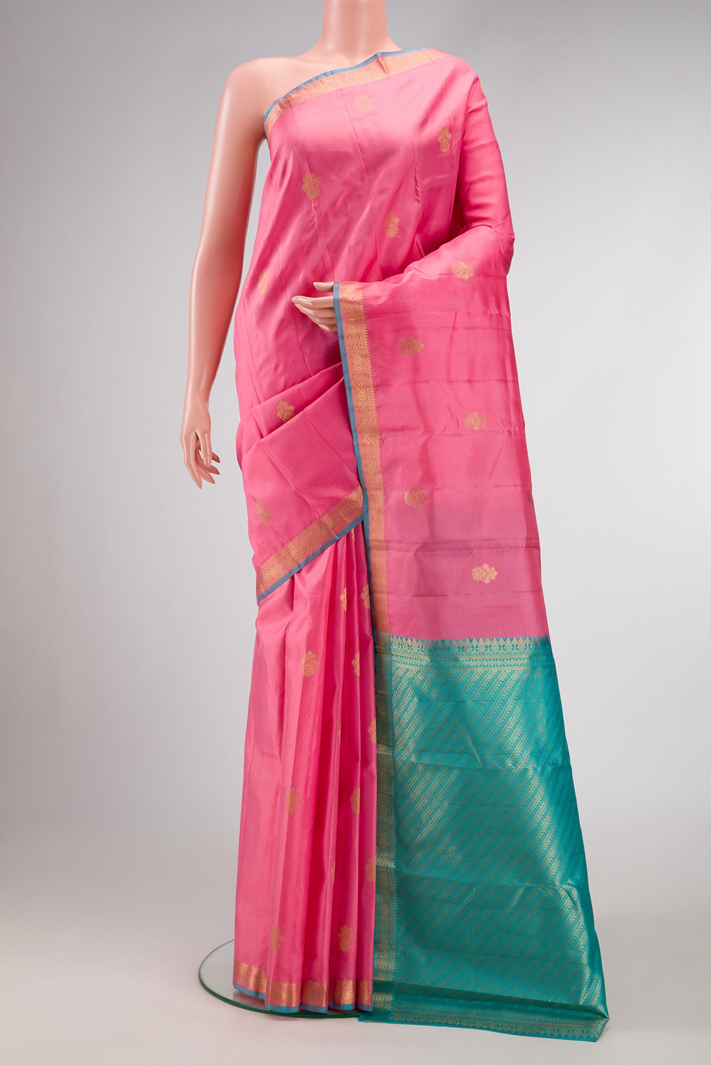 Pink Dual Tone Kanchipuram Silk Saree with Zari Butta on the body and Zari Border.  displayed on a mannequin