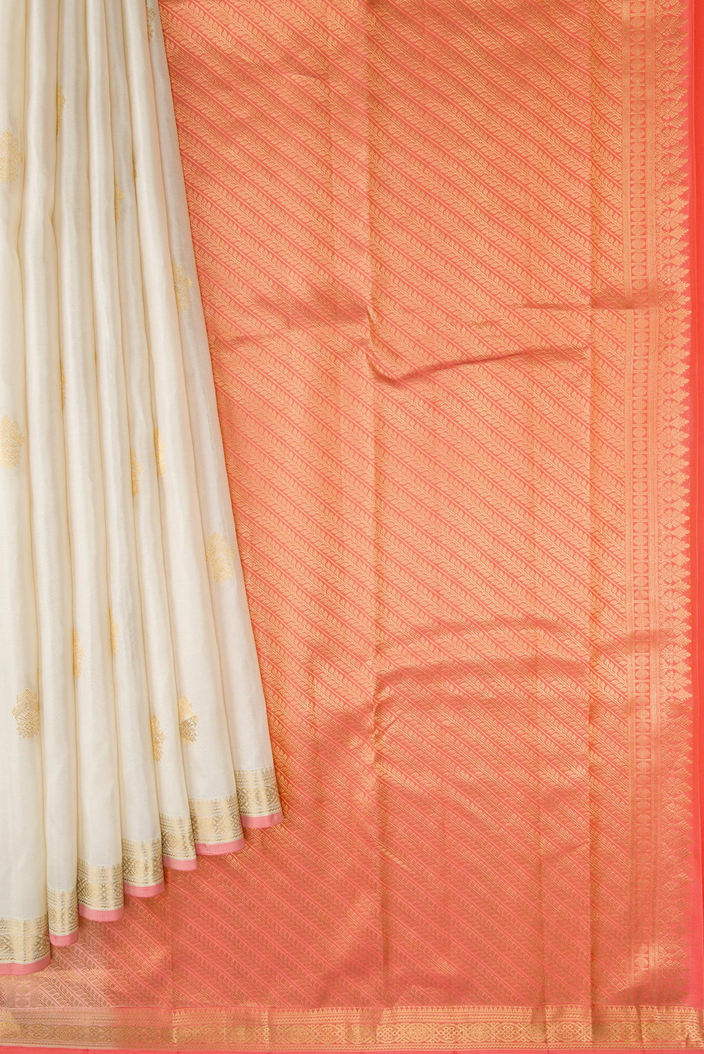Pleats and pallu of Off White Dual Tone Kanchipuram Silk Saree with Zari Butta on the body and Zari Border. 