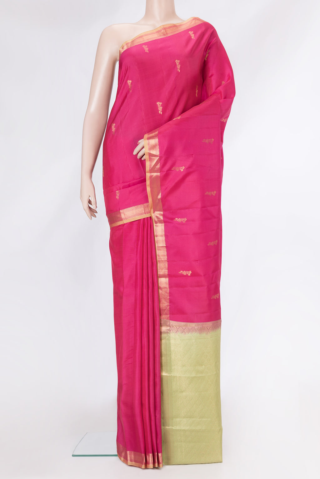 Pink Kanchipuram Silk Saree with Zari Butta on the body and Zari Border.  displayed on a mannequin