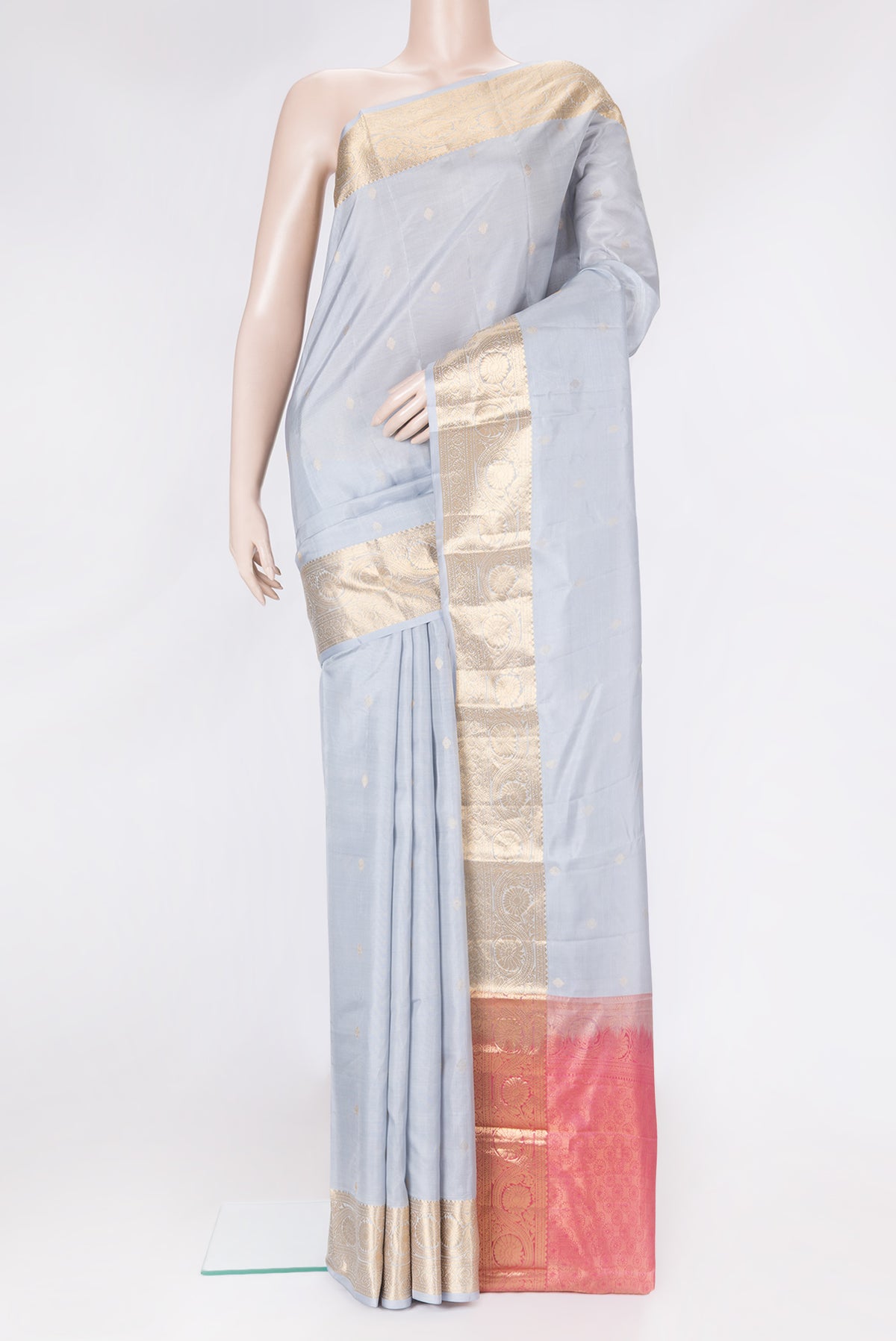Grey Dual Tone Kanchipuram Silk Saree with Zari Butta on the body and Zari Border.  displayed on a mannequin