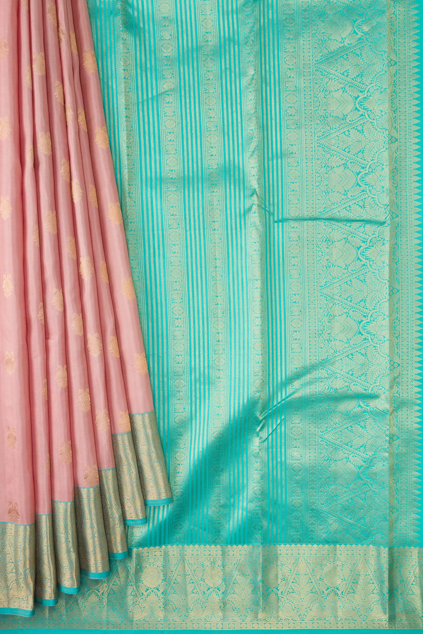 Pleats and pallu of Rose Gold Dual Tone Kanchipuram Silk Saree with Zari Butta on the body and Zari Border. 