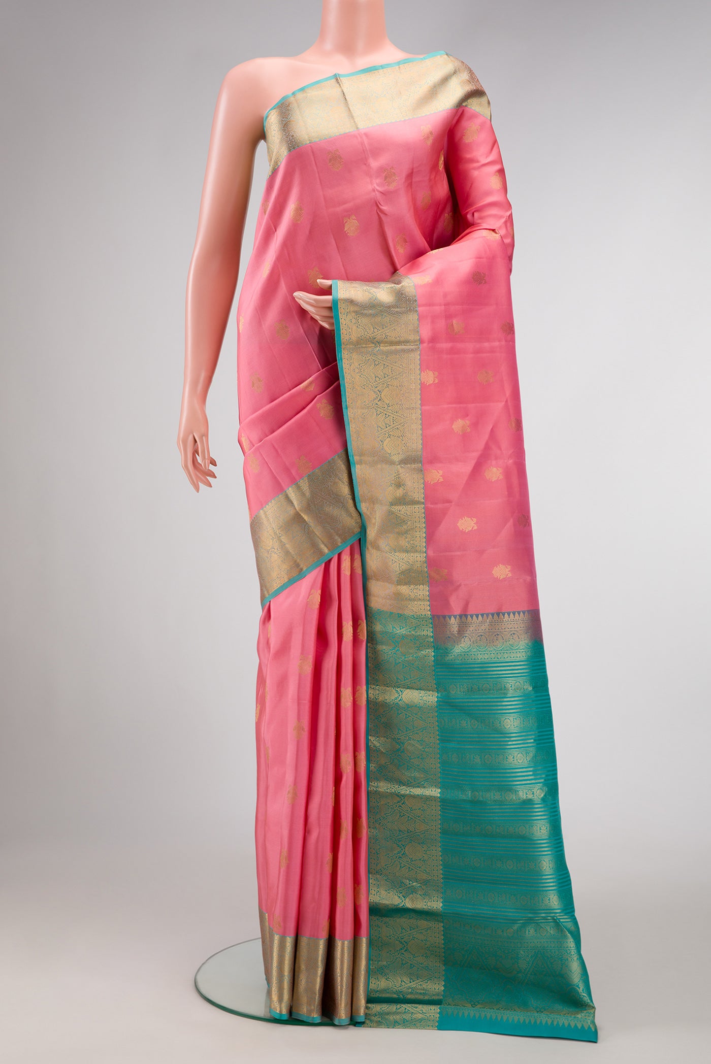 Pink Dual Tone Kanchipuram Silk Saree with Zari Butta on the body and Zari Border.  displayed on a mannequin