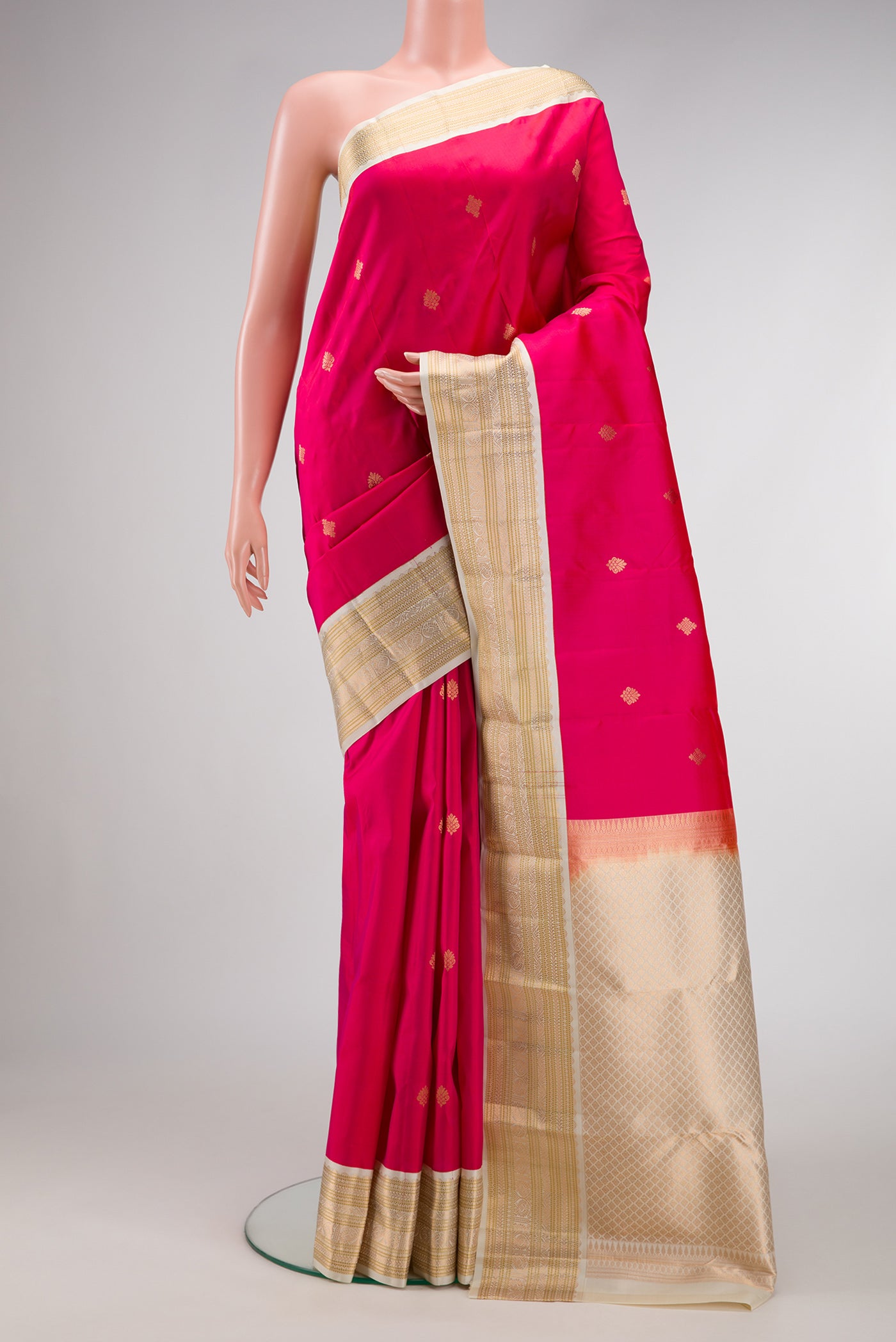 Pink Dual Tone Kanchipuram Silk Saree with Zari Butta on the body and Zari Border.  displayed on a mannequin