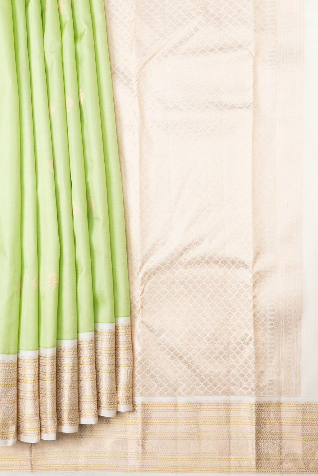 Pleats and pallu of Pista Green Dual Tone Kanchipuram Silk Saree with Zari Butta on the body and Zari Border. 