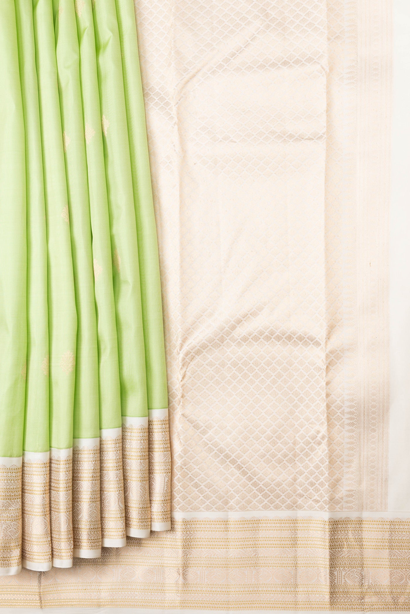Pleats and pallu of Pista Green Dual Tone Kanchipuram Silk Saree with Zari Butta on the body and Zari Border. 