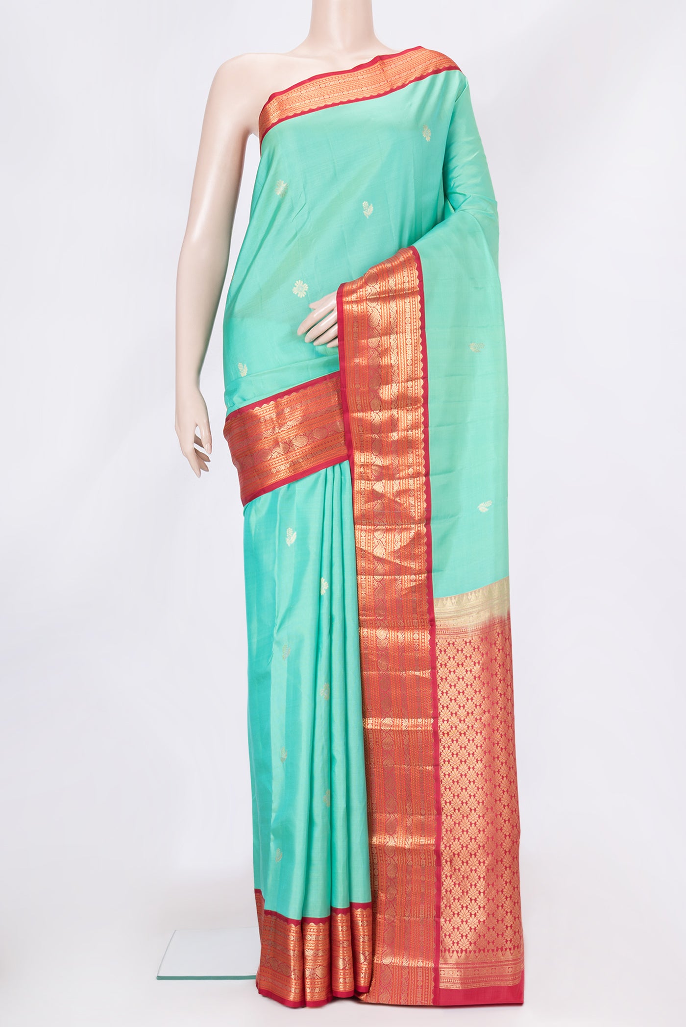 Sea Green Dual Tone Kanchipuram Silk Saree with Zari Butta on the body and Zari Border.  displayed on a mannequin