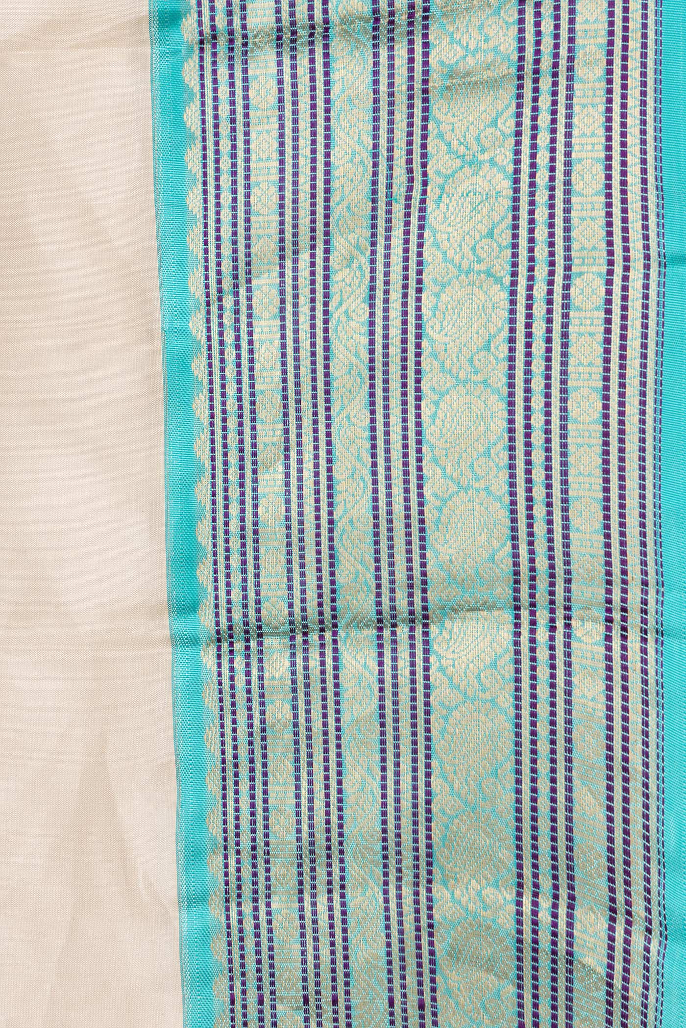 Border image of Beige Dual Tone Kanchipuram Silk Saree with Zari Butta on the body and Zari And Thread Border. 