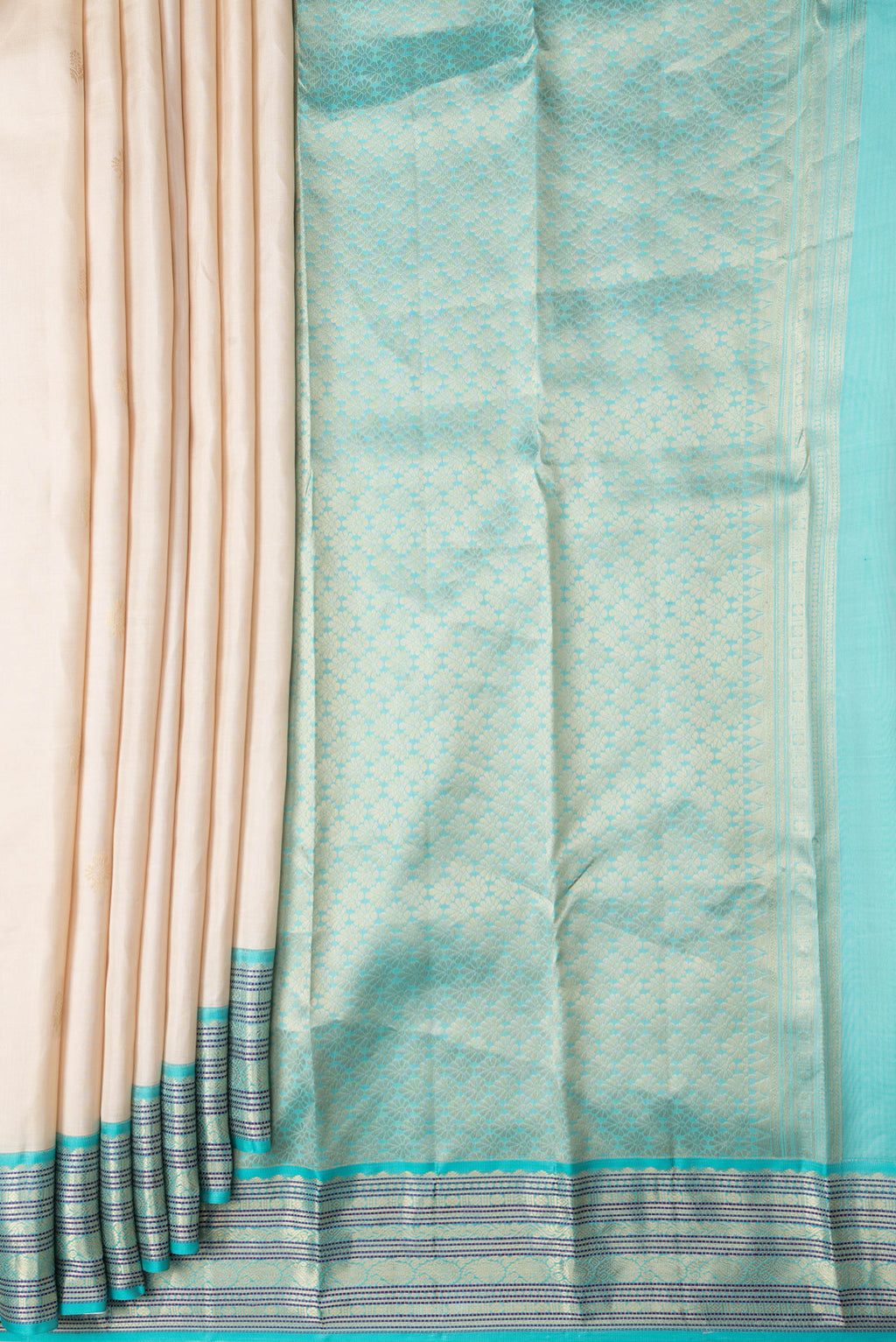 Pleats and pallu of Beige Dual Tone Kanchipuram Silk Saree with Zari Butta on the body and Zari And Thread Border. 