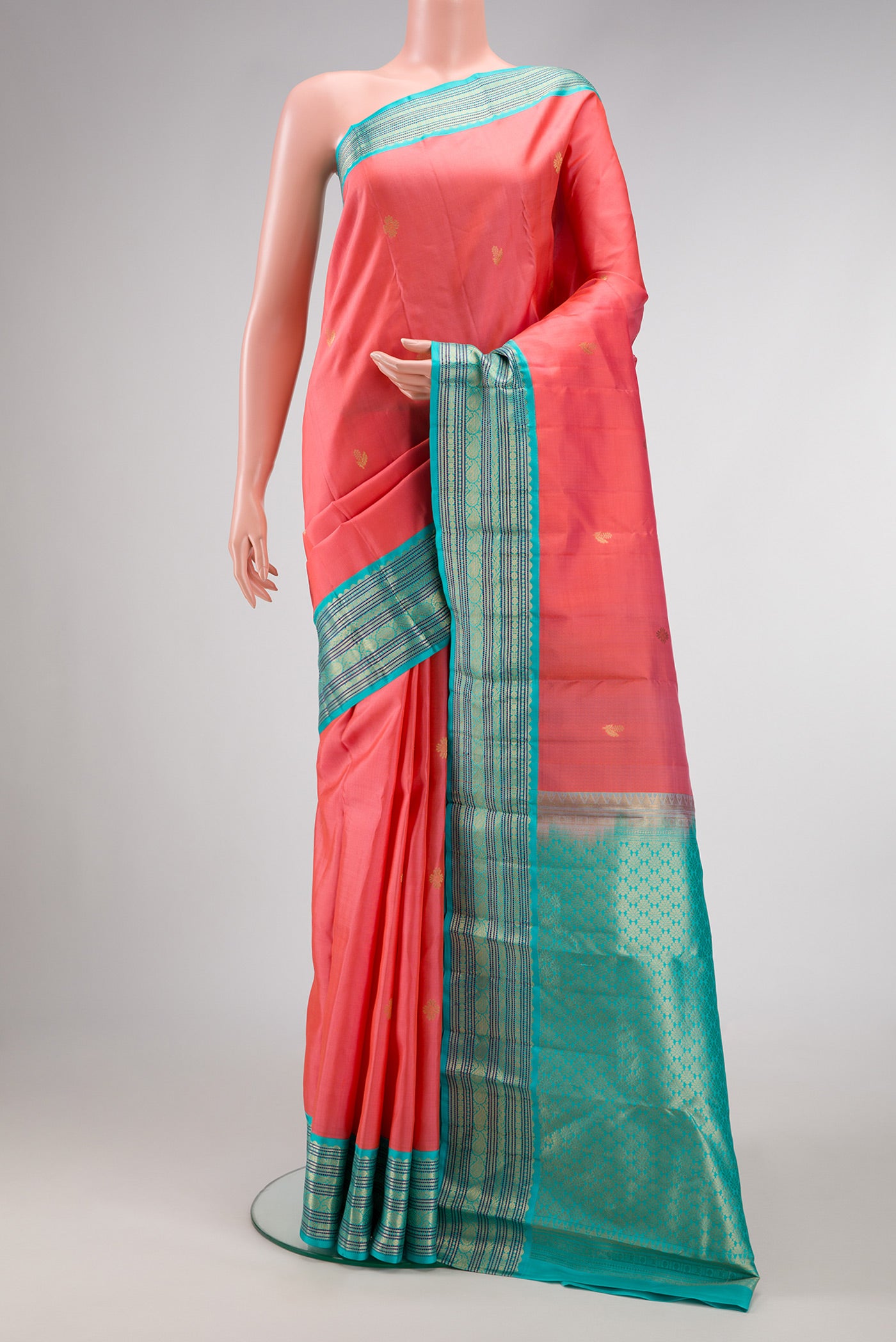 Pink Dual Tone Kanchipuram Silk Saree with Zari Butta on the body and Zari Border.  displayed on a mannequin