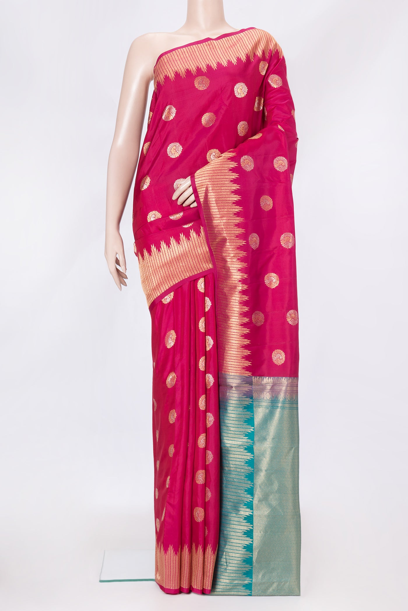 Dark Pink Dual Tone Kanjivaram Silk Saree with Zari Butta on the body and Fancy Border.  displayed on a mannequin