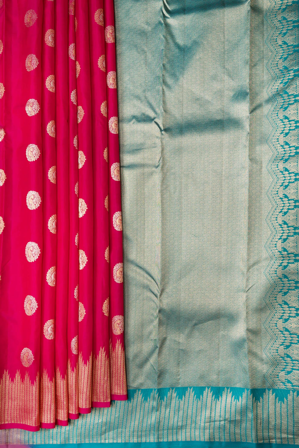 Pleats and pallu of Dark Pink Dual Tone Kanjivaram Silk Saree with Zari Butta on the body and Fancy Border. 
