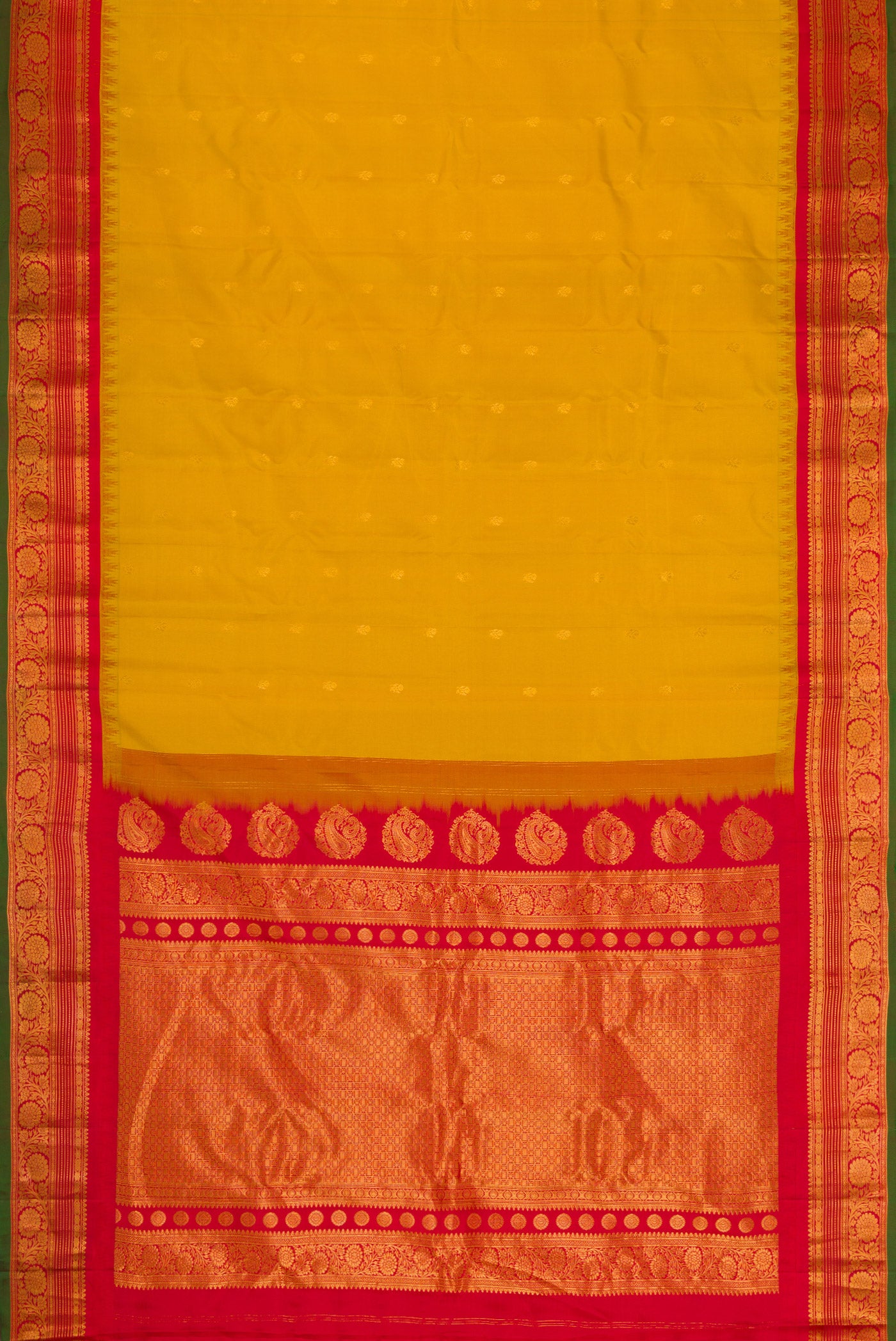 Flat view of Mustard Dual Tone Gadwal Silk Saree with Zari Butta on the body and Zari Border. 