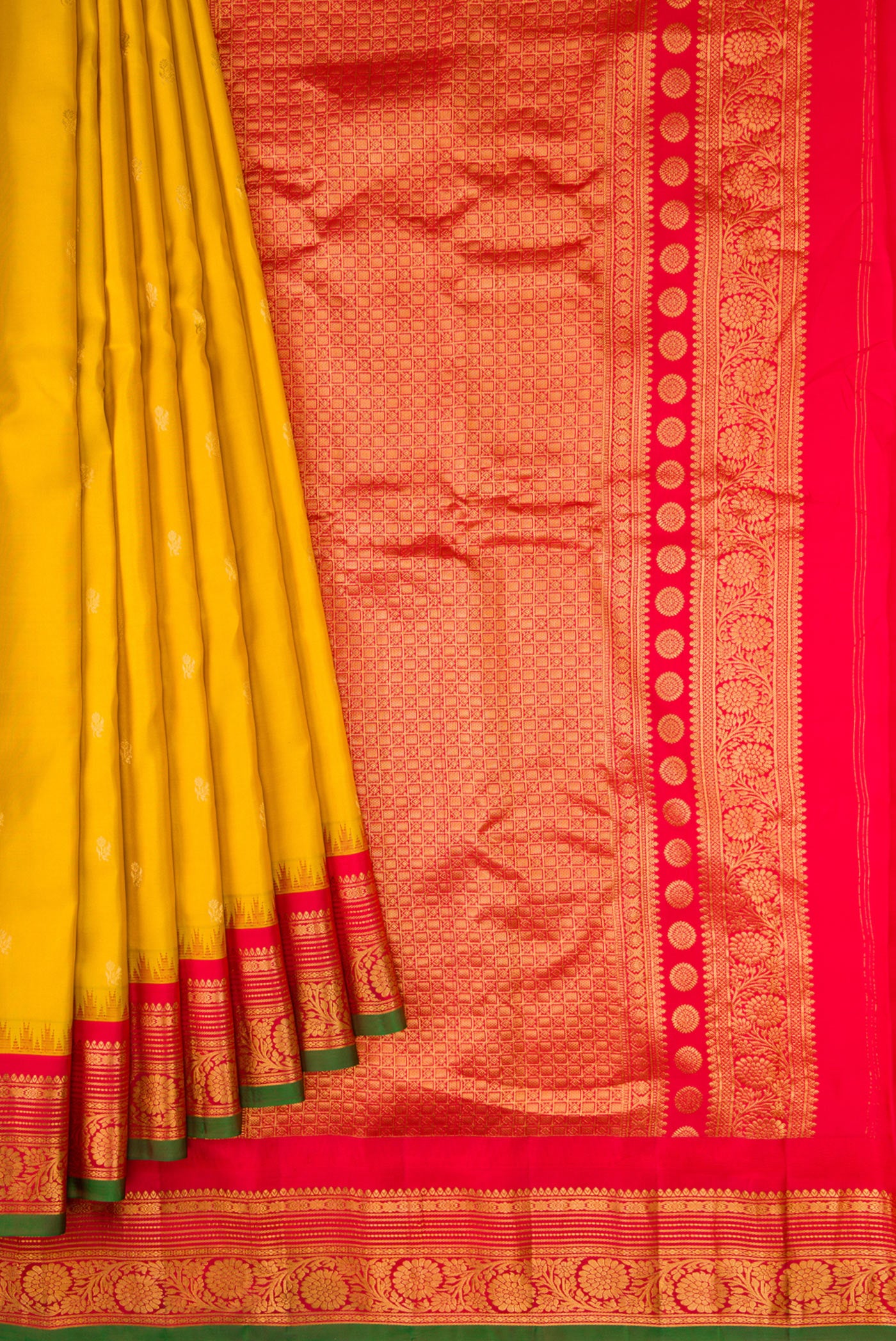 Pleats and pallu of Mustard Dual Tone Gadwal Silk Saree with Zari Butta on the body and Zari Border. 