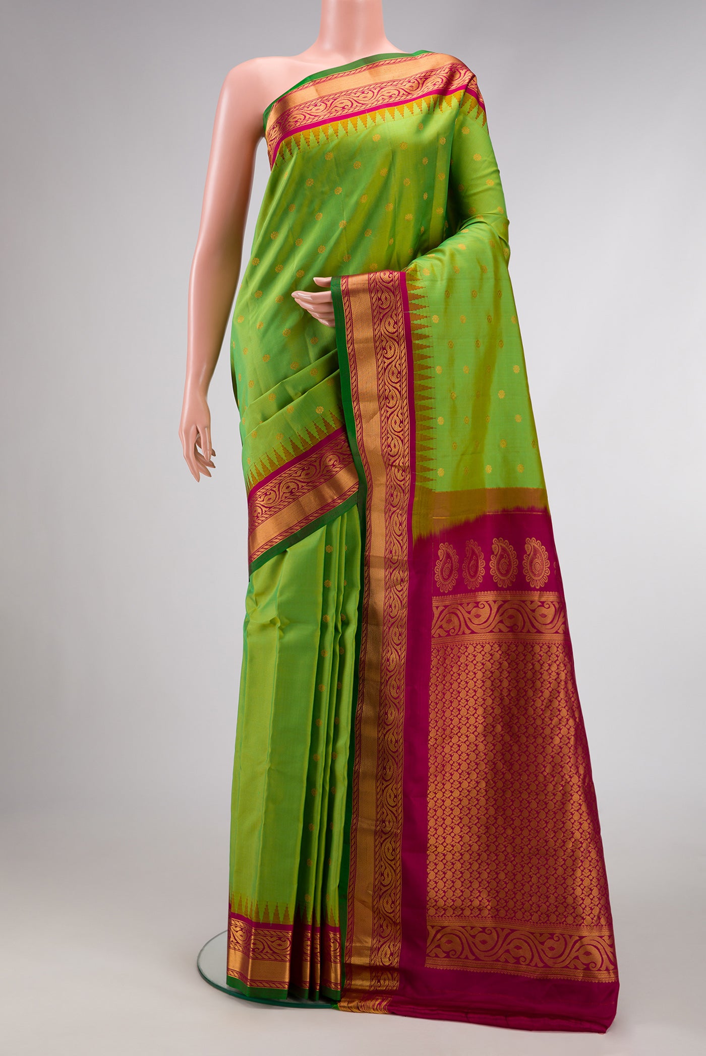 Parrot Green Dual Tone Gadwal Silk Saree with Zari Butta on the body and Zari Border.  displayed on a mannequin