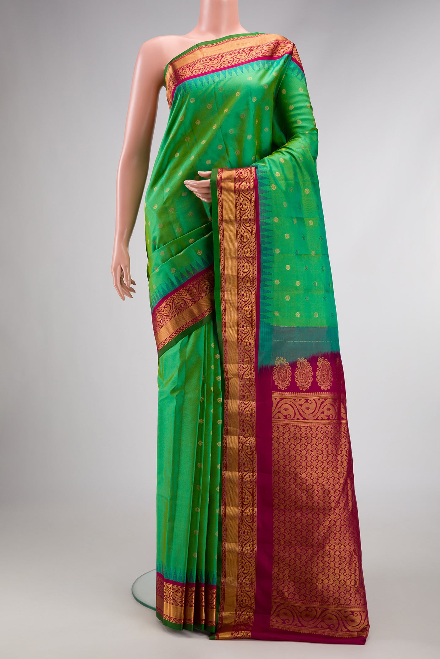 Green Dual Tone Gadwal Silk Saree with Zari Butta on the body and Zari Border.  displayed on a mannequin
