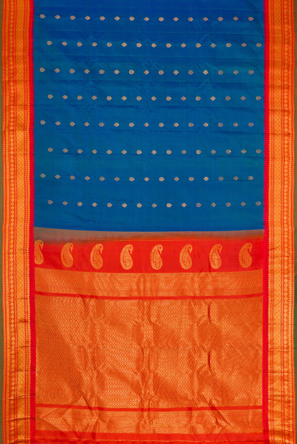 Flat view of Sky Blue Dual Tone Gadwal Silk Saree with Zari Butta on the body and Zari Border. 