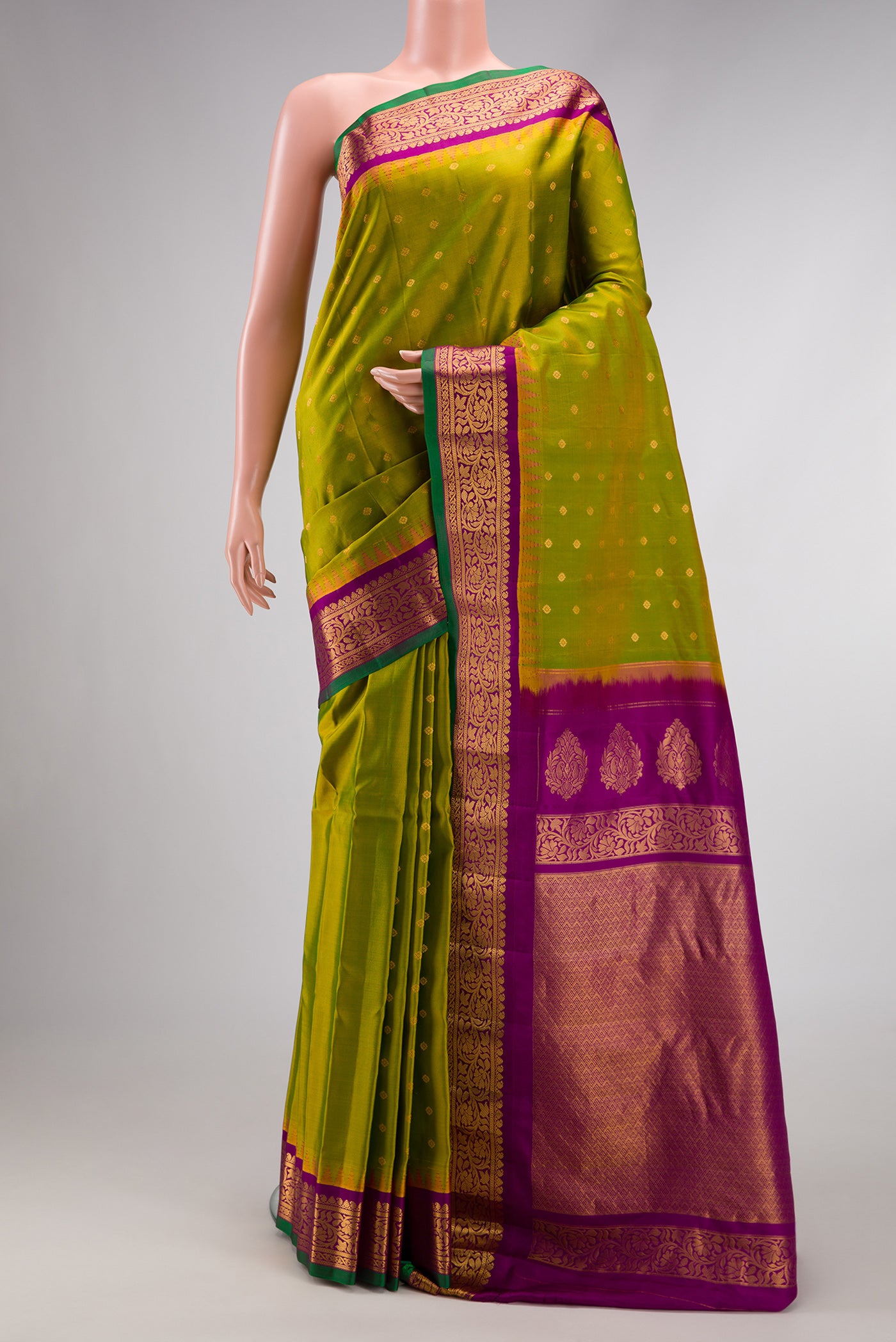 Mehandi Green Dual Tone Gadwal Silk Saree with Zari Butta on the body and Zari Border.  displayed on a mannequin