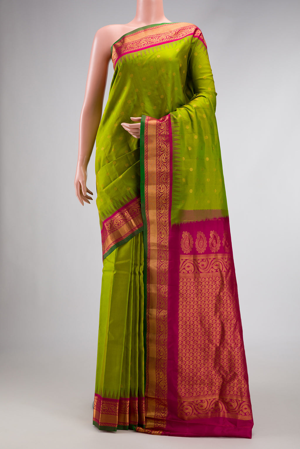 Parrot Green Dual Tone Gadwal Silk Saree with Zari Butta on the body and Zari Border.  displayed on a mannequin