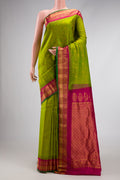 Parrot Green Dual Tone Gadwal Silk Saree with Zari Butta on the body and Zari Border.  displayed on a mannequin